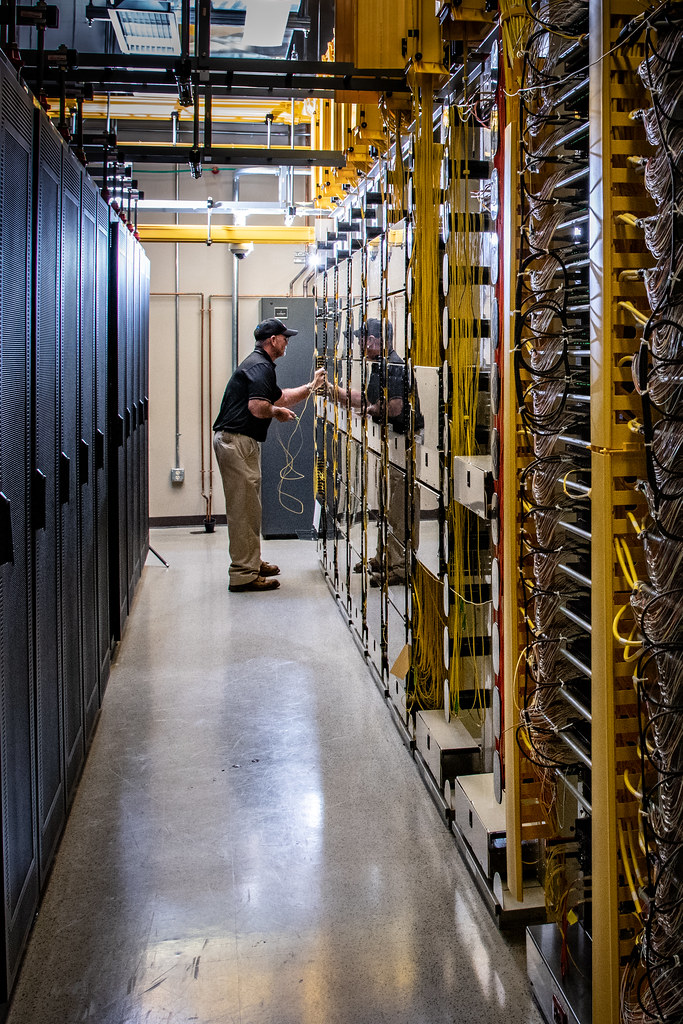Engineer in a server room aisle